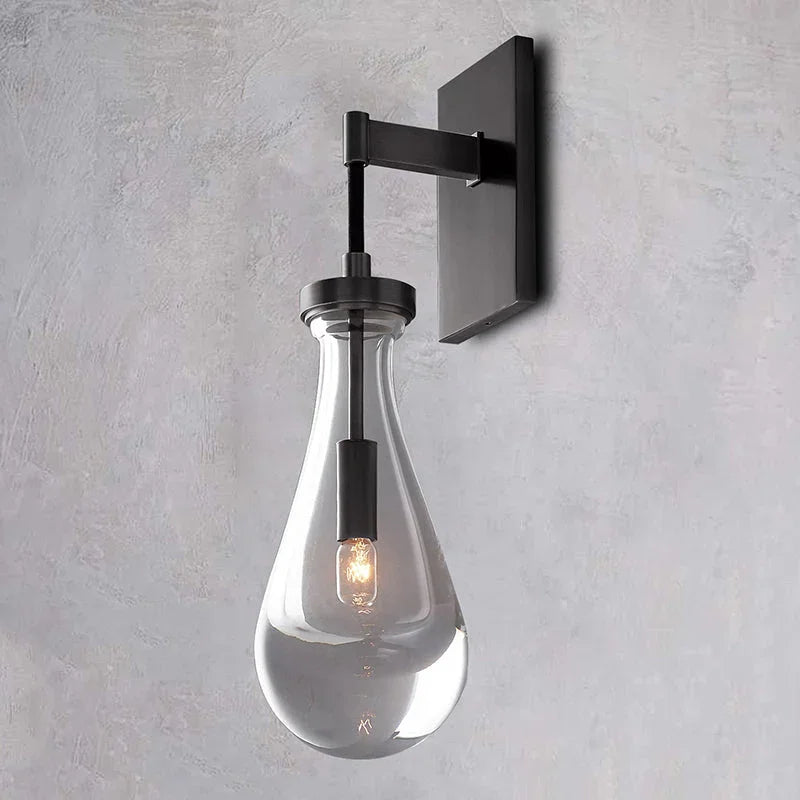 Modern raindrop glass wall sconce with black mount by YH Lamps, elegant indoor lighting