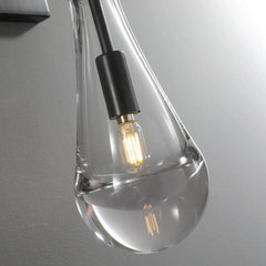 Modern raindrop glass wall sconce with exposed bulb on gray wall, YH Lamps home lighting
