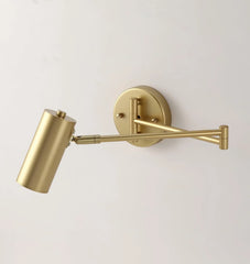 Modern gold swing arm wall sconce with cylindrical shade and wall switch ideal for home lighting