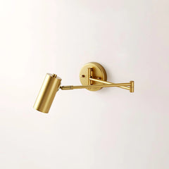 Modern gold swing arm wall lamp with cylindrical shade mounted on white wall