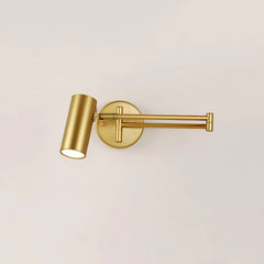 Modern gold swing arm wall lamp with cylindrical shade on beige wall, warm light, adjustable arm sconce