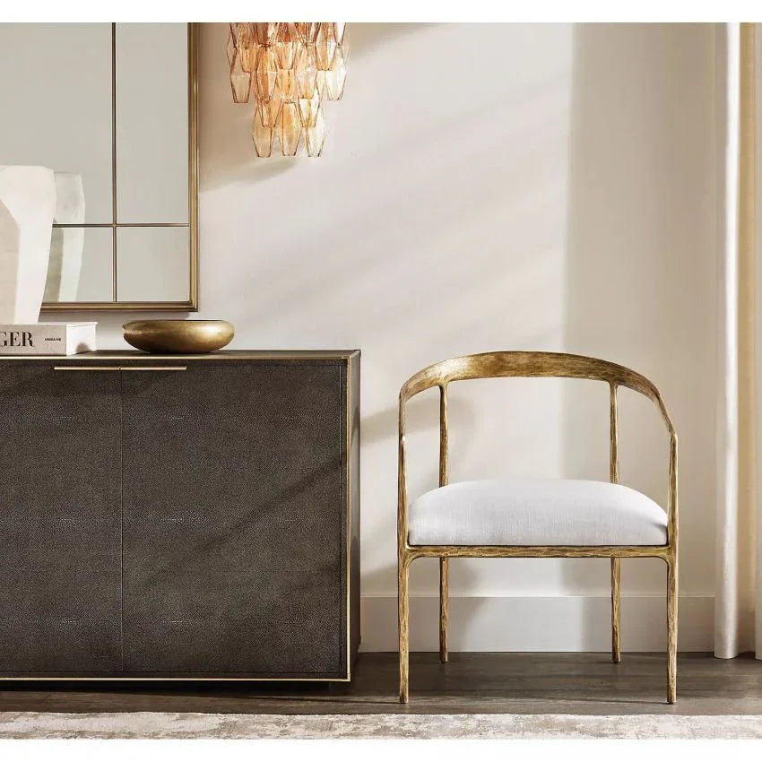Modern Murano clear glass wall sconce above gold accent chair and stylish console, YH Lamps