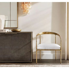 Modern Murano clear glass wall sconce above gold accent chair and stylish console, YH Lamps