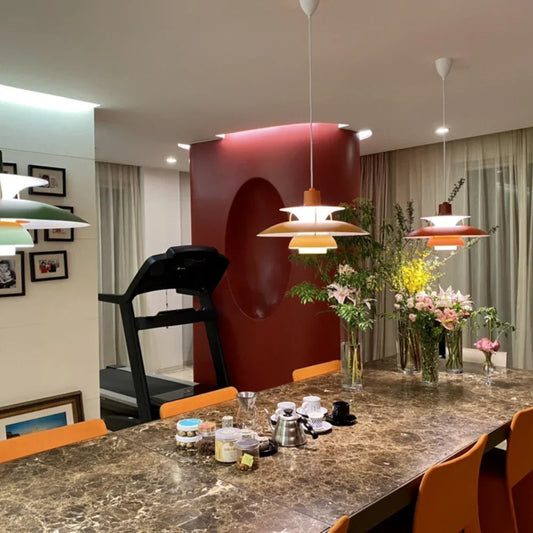 Modern chandelier pendant lamps above marble dining table with flowers, YH Lamps designer lighting